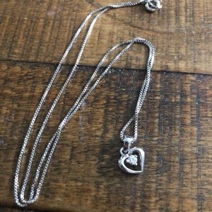 Petite heart shaped, single diamond pendant